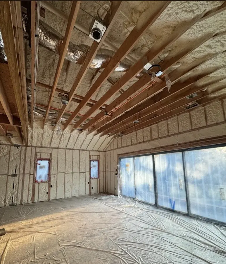Interior walls and ceiling insulated with spray foam during new construction in Alhambra